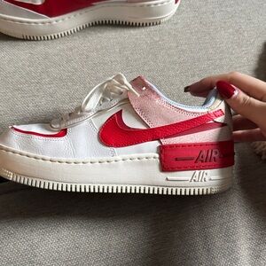 Pink and red Air Force 1s